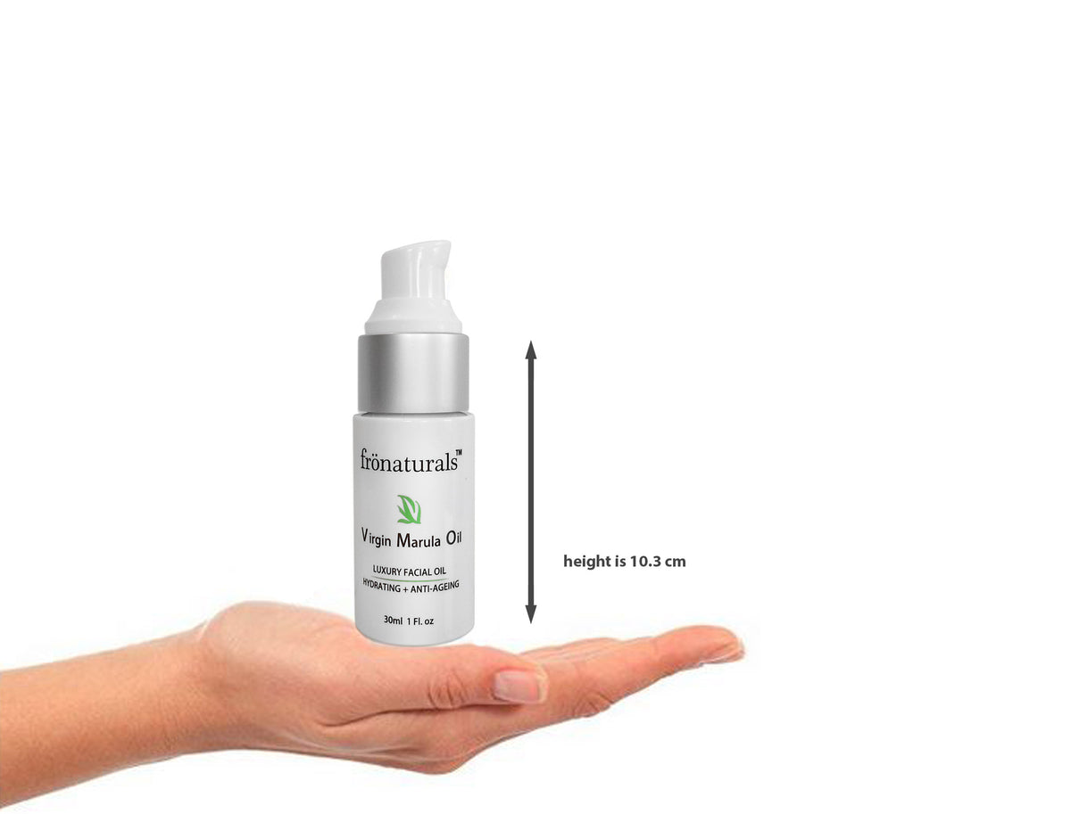 Marula Oil 30 ml pump bottle above an open palm, with its height marked as 10.3 cm.”